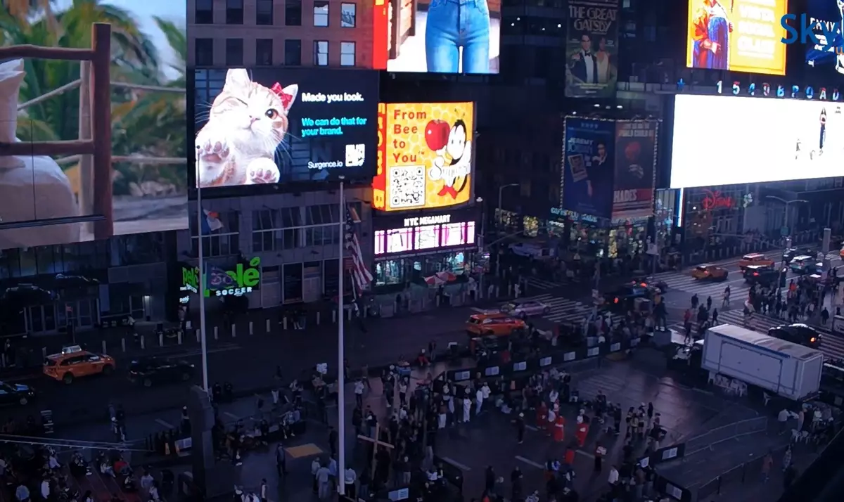 Surgence on the Times Square billboard at night