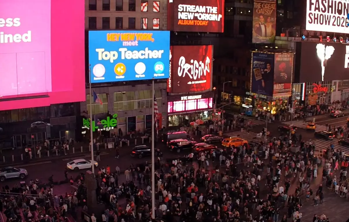 Top Teacher on the Times Square billboard at night